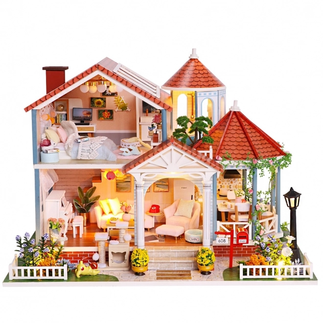 Ni miniature huse farvet glasur hus