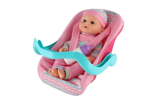 Dukke baby 30cm plast i bæreslynge/autostol med flaske i blister