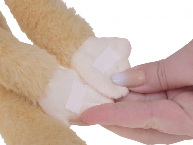 Hængende abe maskot i beige farve