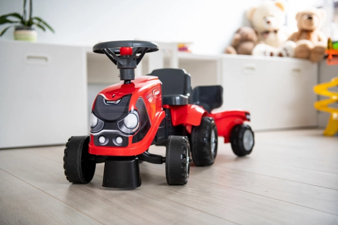 Kørende traktor Baby Case IH rød med trailer