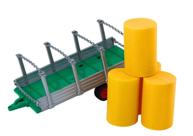 Stor traktor med trailer og høballer