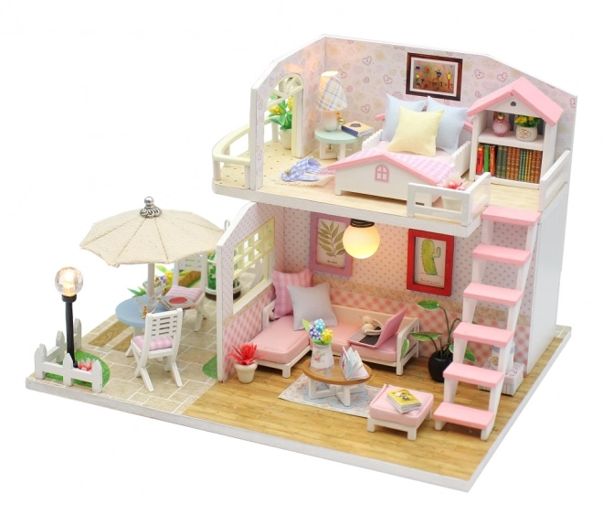Ni små miniature huse Lyserødt hus
