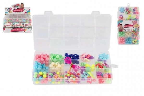 Plastperler farverige med snor i plastboks 10x17x2cm