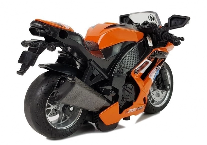 Orange legetøjsmotorcykel med fremdrift