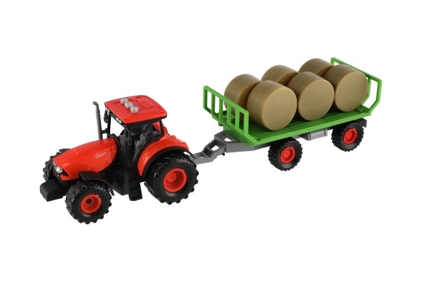 Traktor Zetor med anhænger og plastballer 36cm med friktion kører på batteri med lys og lyd i æske 39x13