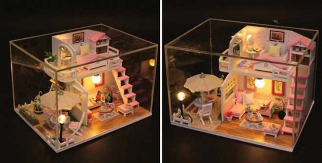 Ni små miniature huse Lyserødt hus