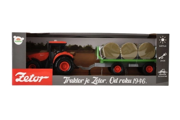 Traktor Zetor med anhænger og plastballer 36cm med friktion kører på batteri med lys og lyd i æske 39x13
