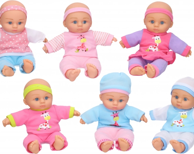 Sød baby med tøj 24 cm