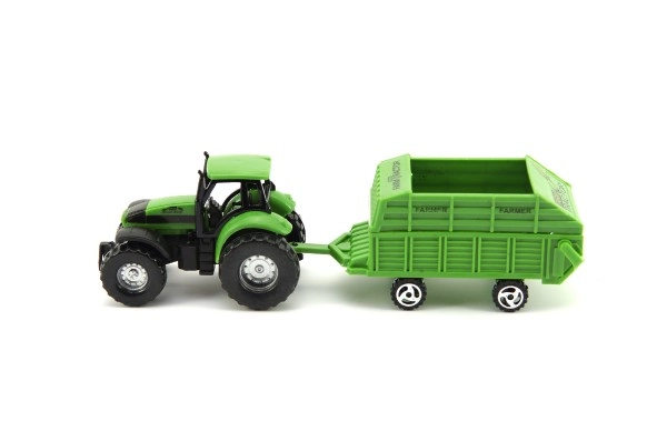 Grøn traktor med realistisk anhænger