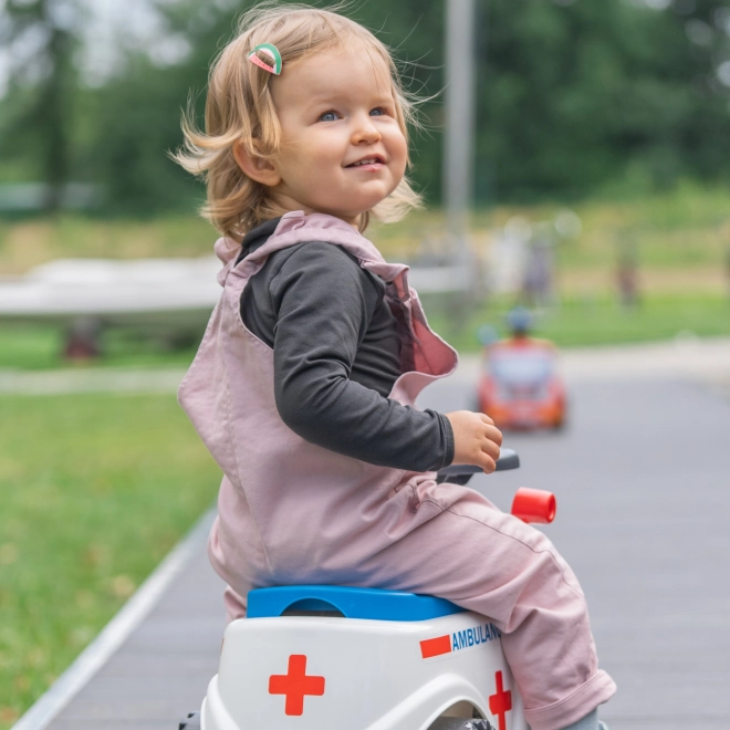 FALK Løbecykel Ambulance med åbent sæde og horn på rattet