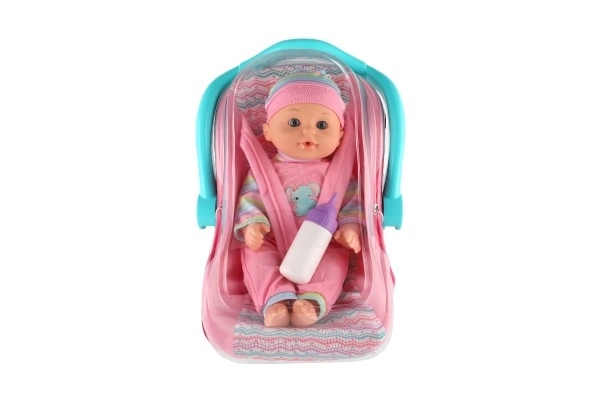Dukke baby 30cm plast i bæreslynge/autostol med flaske i blister
