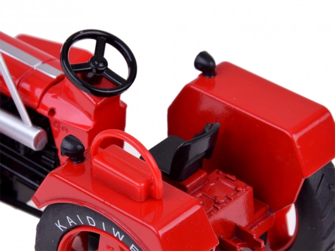 Rød metaltraktor med gummihjul 1:18
