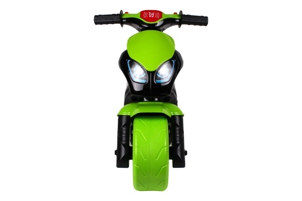 Løbecykel motorcykel grøn-sort plast på batterier med lys og lyd i pose 36x53x74cm