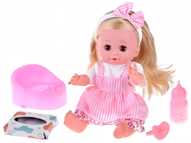 Babydukke med langt hår, taler og græder