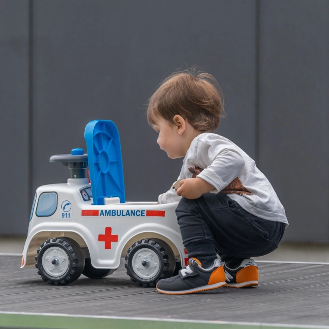 FALK Løbecykel Ambulance med åbent sæde og horn på rattet