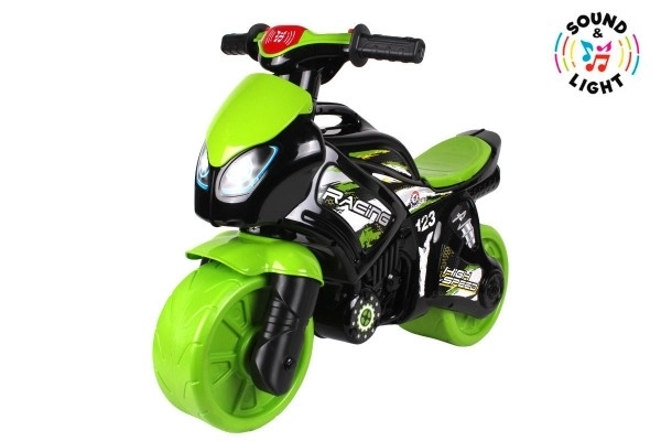 Løbecykel motorcykel grøn-sort plast på batterier med lys og lyd i pose 36x53x74cm