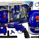 Politisæt med hjelm og batteridrevne legetøj